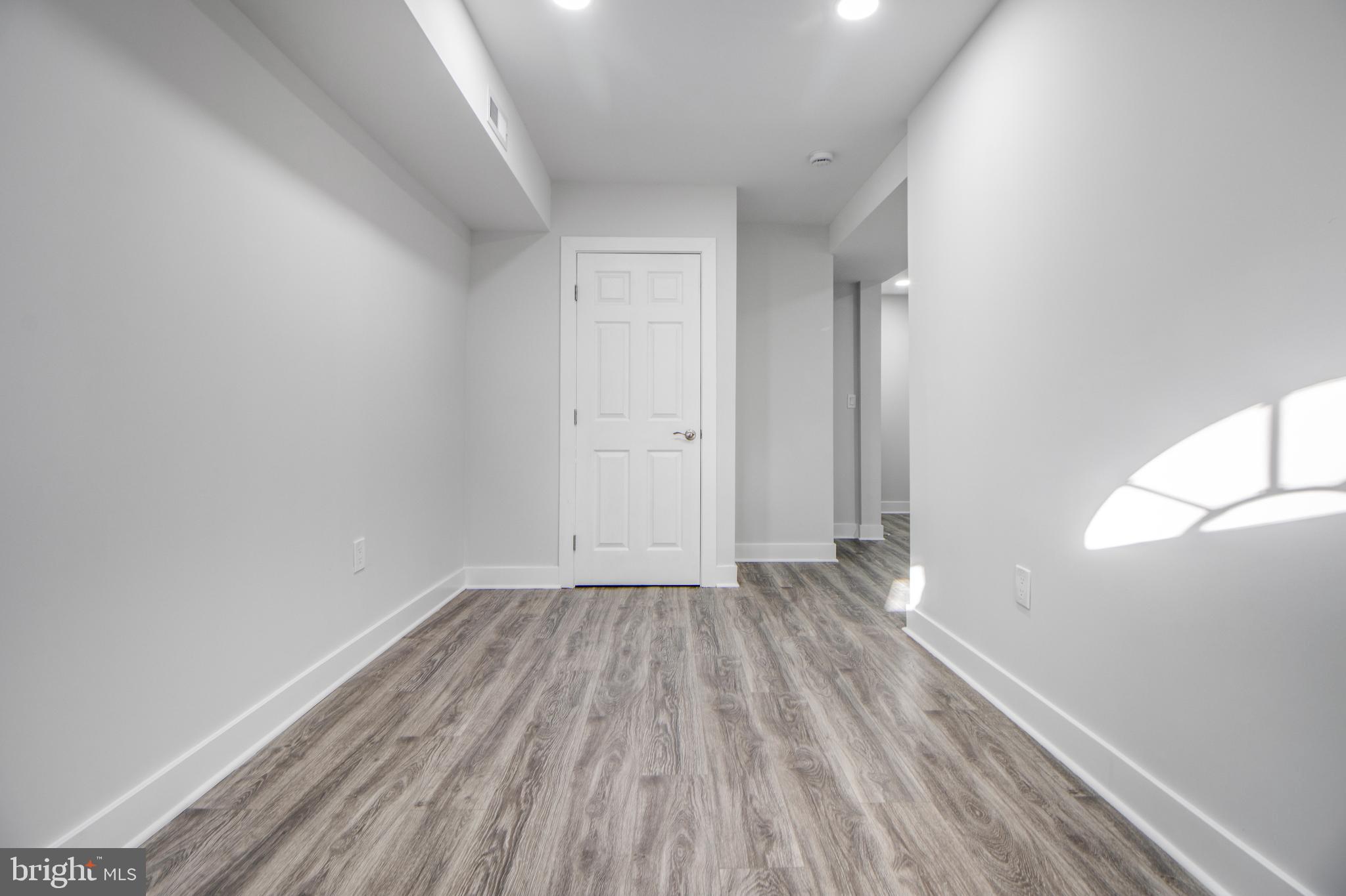 3706 Overview Road Baltimore, MD 21215 - Photo 23 of 47 a view of an empty room and wooden floor