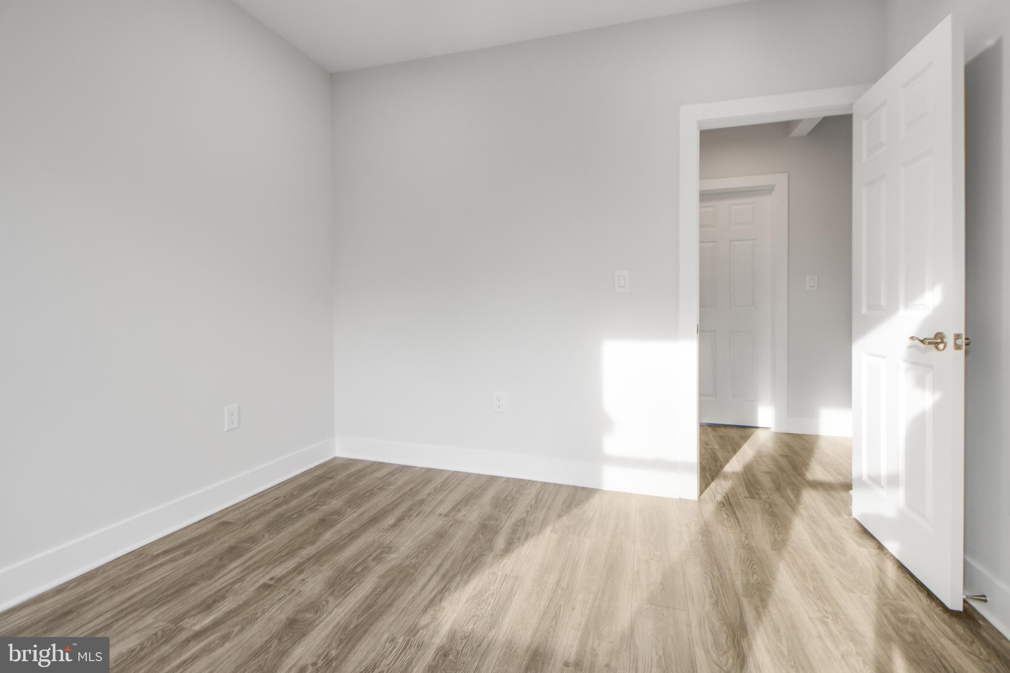 3706 Overview Road Baltimore, MD 21215 - Photo 24 of 47 a view of a room with wooden floor and a window