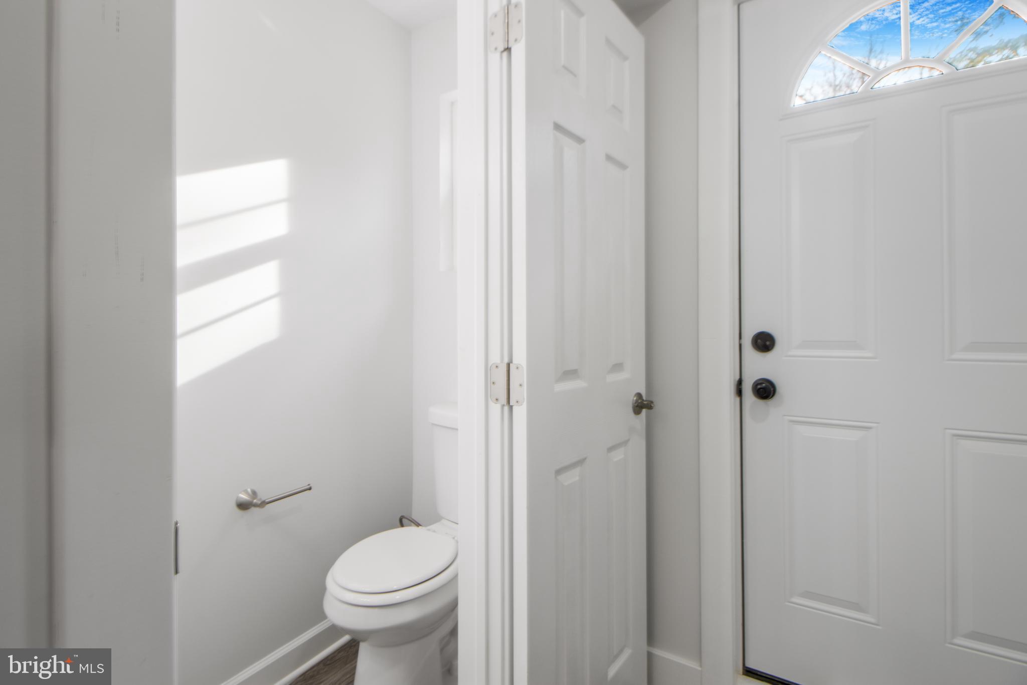 3706 Overview Road Baltimore, MD 21215 - Photo 32 of 47 a bathroom with a toilet and a shower