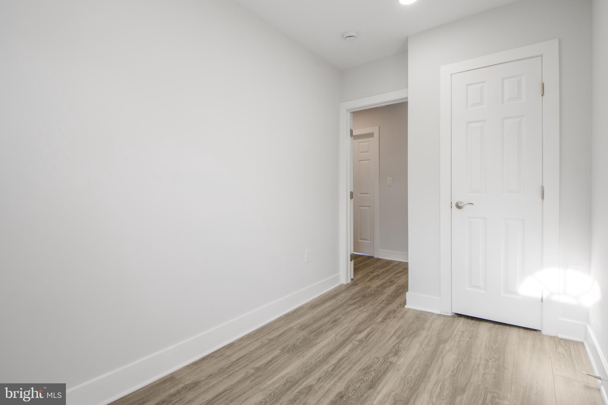 3706 Overview Road Baltimore, MD 21215 - Photo 36 of 47 a view of an empty room with wooden floor