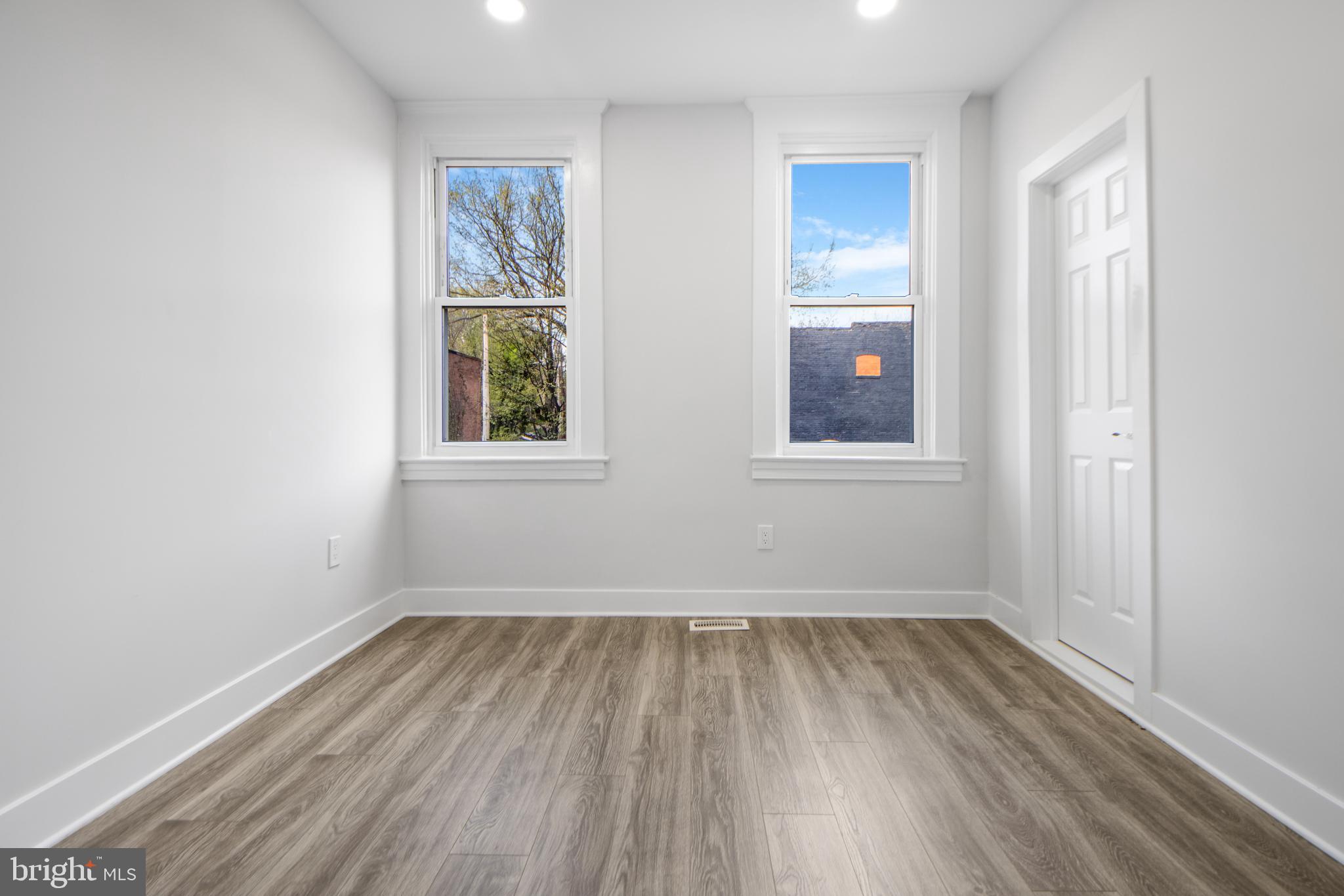 3706 Overview Road Baltimore, MD 21215 - Photo 38 of 47 an empty room with a window and wooden floor