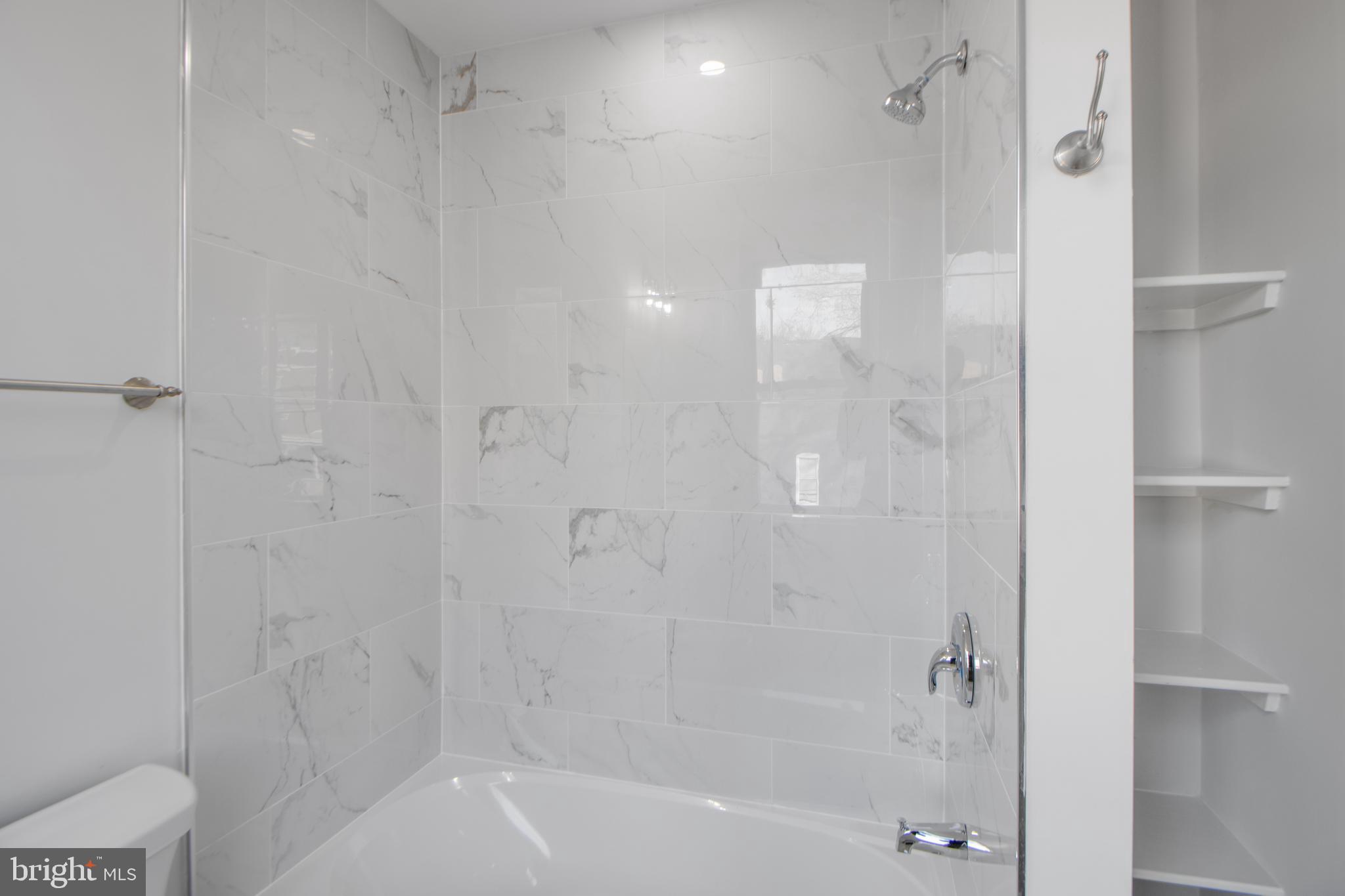 3706 Overview Road Baltimore, MD 21215 - Photo 41 of 47 a bathroom with a shower and bathtub