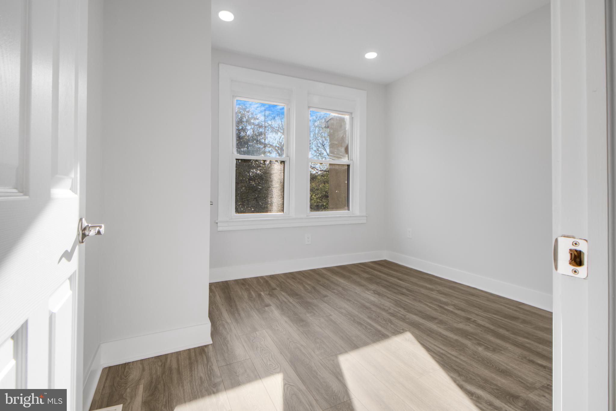 3706 Overview Road Baltimore, MD 21215 - Photo 42 of 47 a view of an empty room with wooden floor and a window