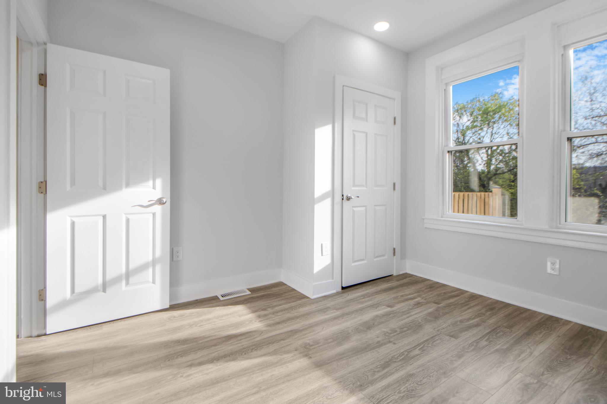 3706 Overview Road Baltimore, MD 21215 - Photo 43 of 47 a view of empty room with wooden floor and fan