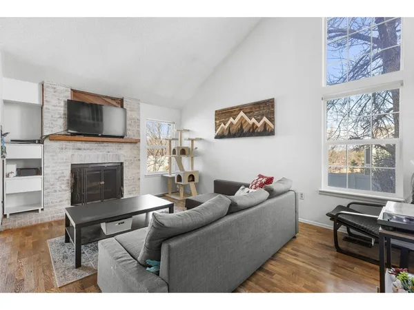a kitchen with stainless steel appliances kitchen island granite countertop a refrigerator and a stove top oven