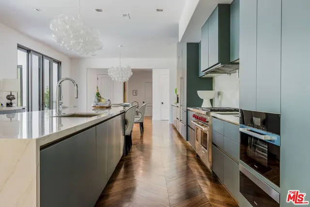 a kitchen with stainless steel appliances granite countertop lots of counter top space and cabinets