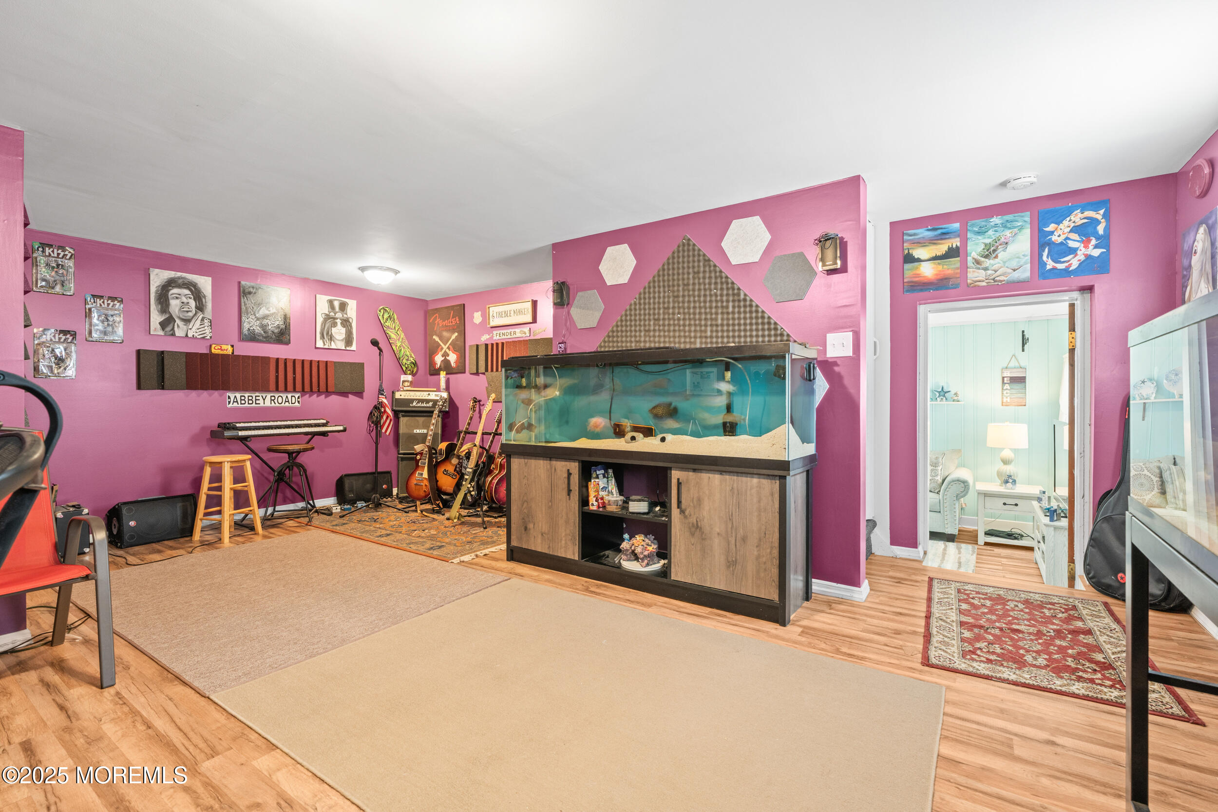 175 Shore Avenue Bogota, NJ 07603 - Photo 14 of 37 a bedroom with furniture and a fireplace