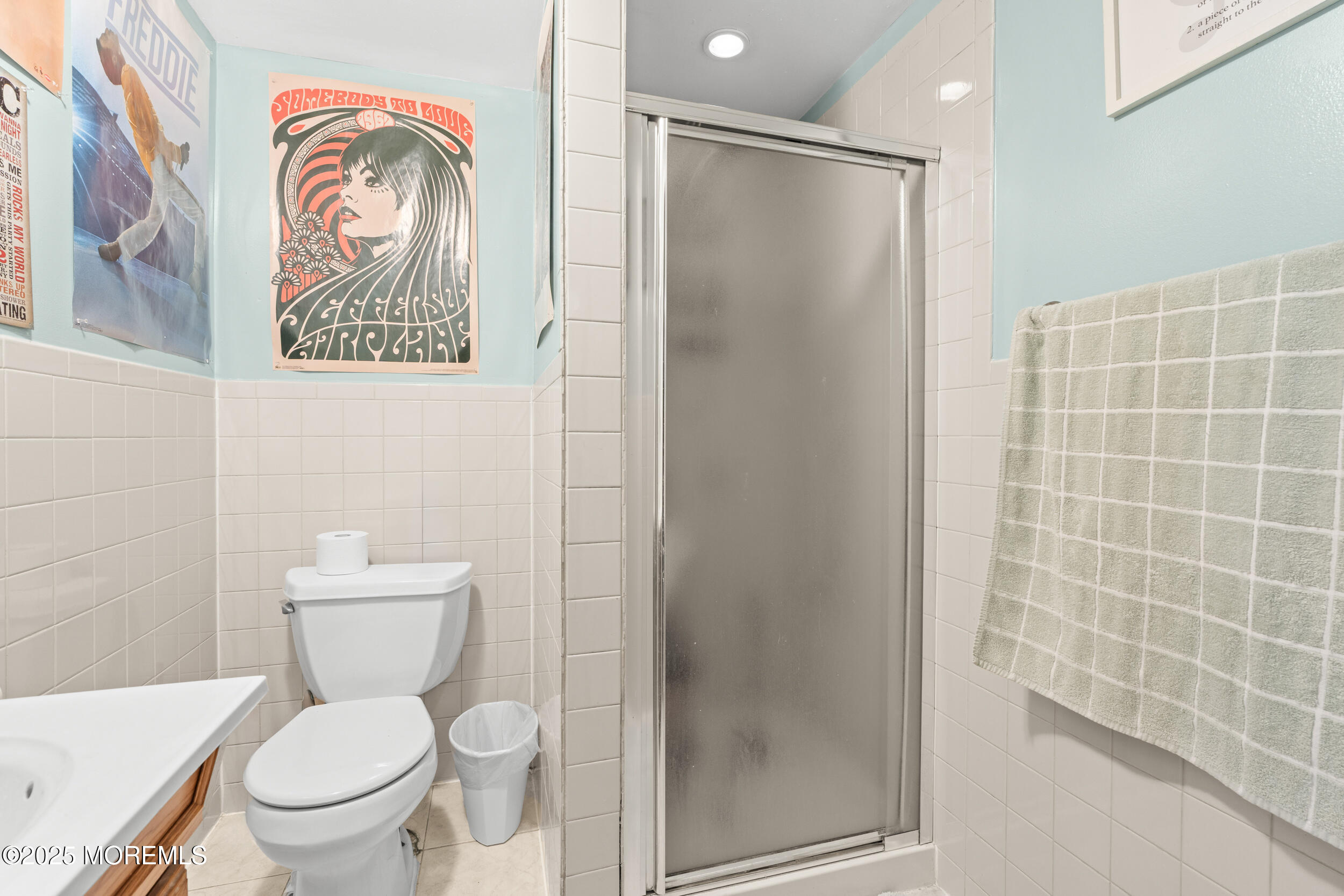 175 Shore Avenue Bogota, NJ 07603 - Photo 15 of 37 a white toilet sitting next to a bathroom sink