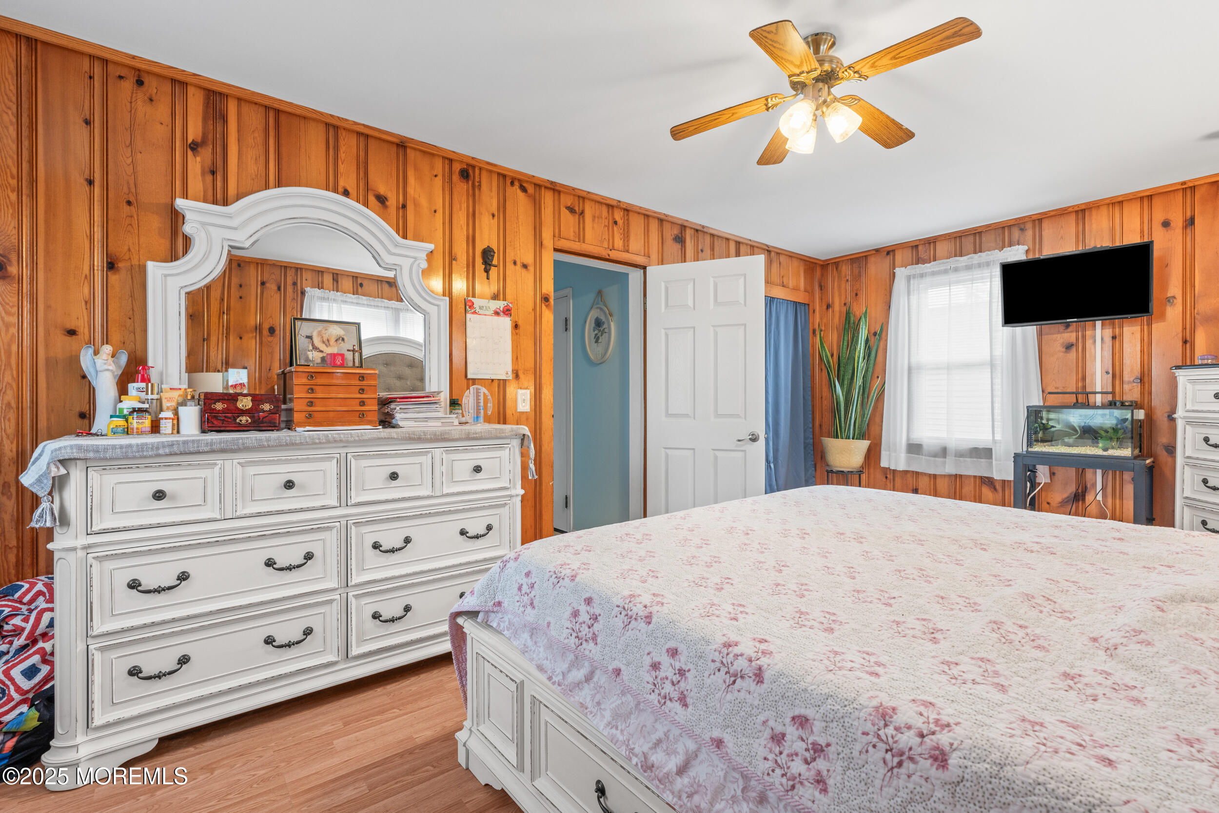 175 Shore Avenue Bogota, NJ 07603 - Photo 18 of 37 a bedroom with a bed and a flat screen tv