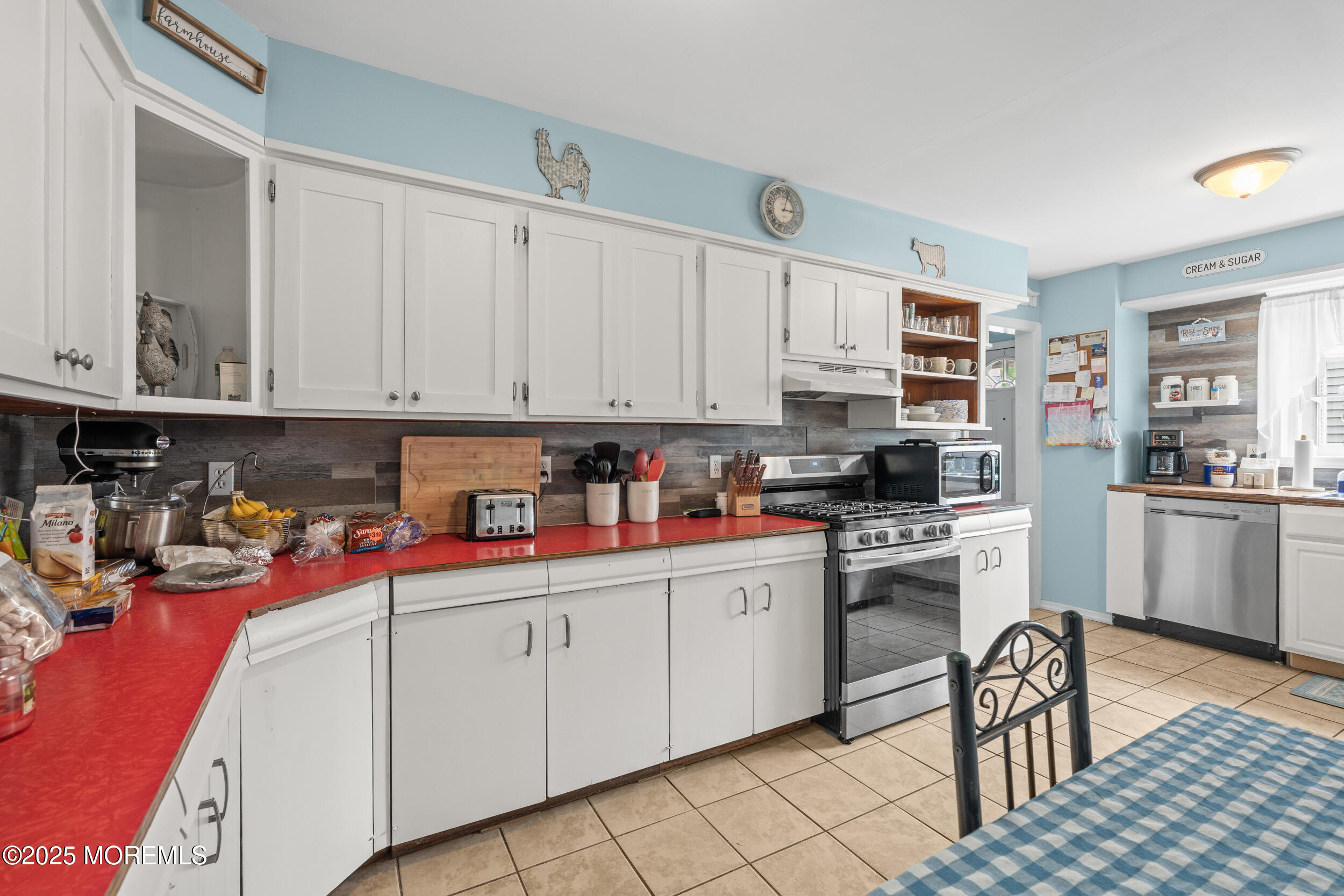 175 Shore Avenue Bogota, NJ 07603 - Photo 24 of 37 a kitchen with stainless steel appliances granite countertop a sink and cabinets
