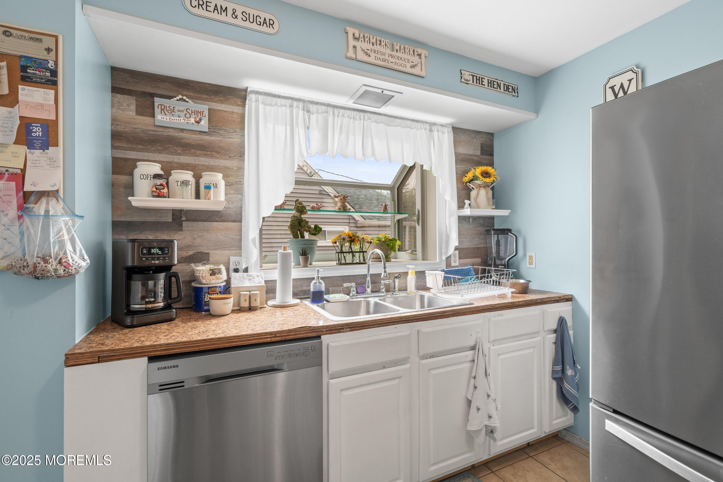 175 Shore Avenue Bogota, NJ 07603 - Photo 27 of 37 a kitchen with a sink and a refrigerator