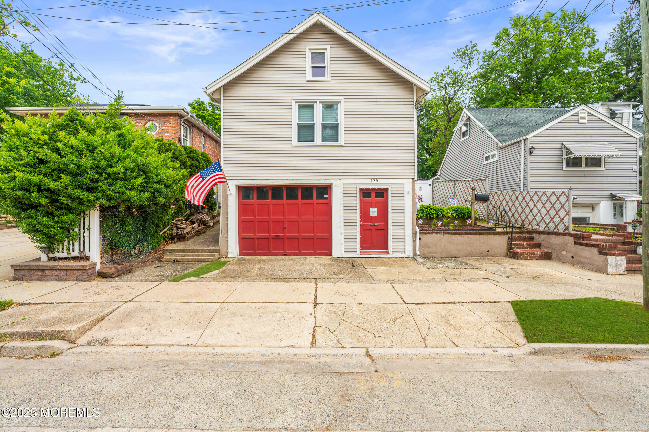 175 Shore Avenue Bogota, NJ 07603 - Photo 37 of 37 a front view of a house with a yard and garage