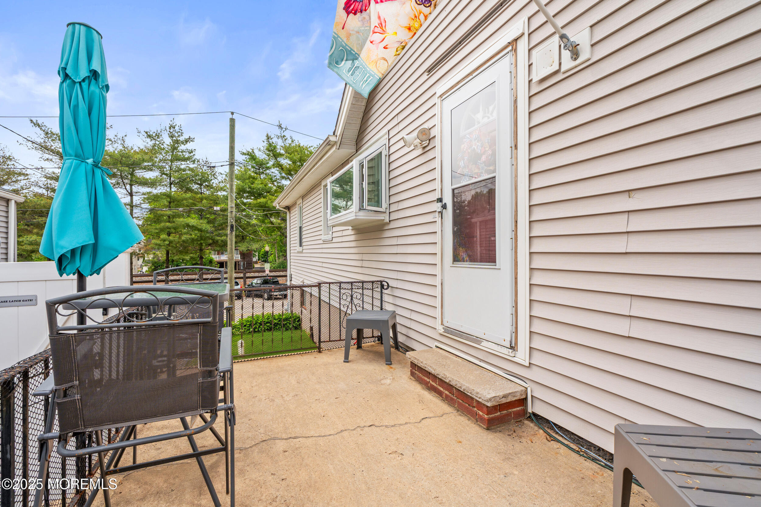 175 Shore Avenue Bogota, NJ 07603 - Photo 5 of 37 a view of a patio with a table and chairs and potted plants