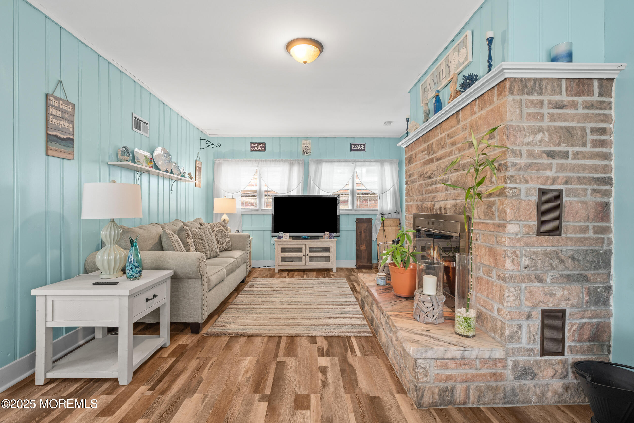 175 Shore Avenue Bogota, NJ 07603 - Photo 6 of 37 a living room with furniture and a flat screen tv