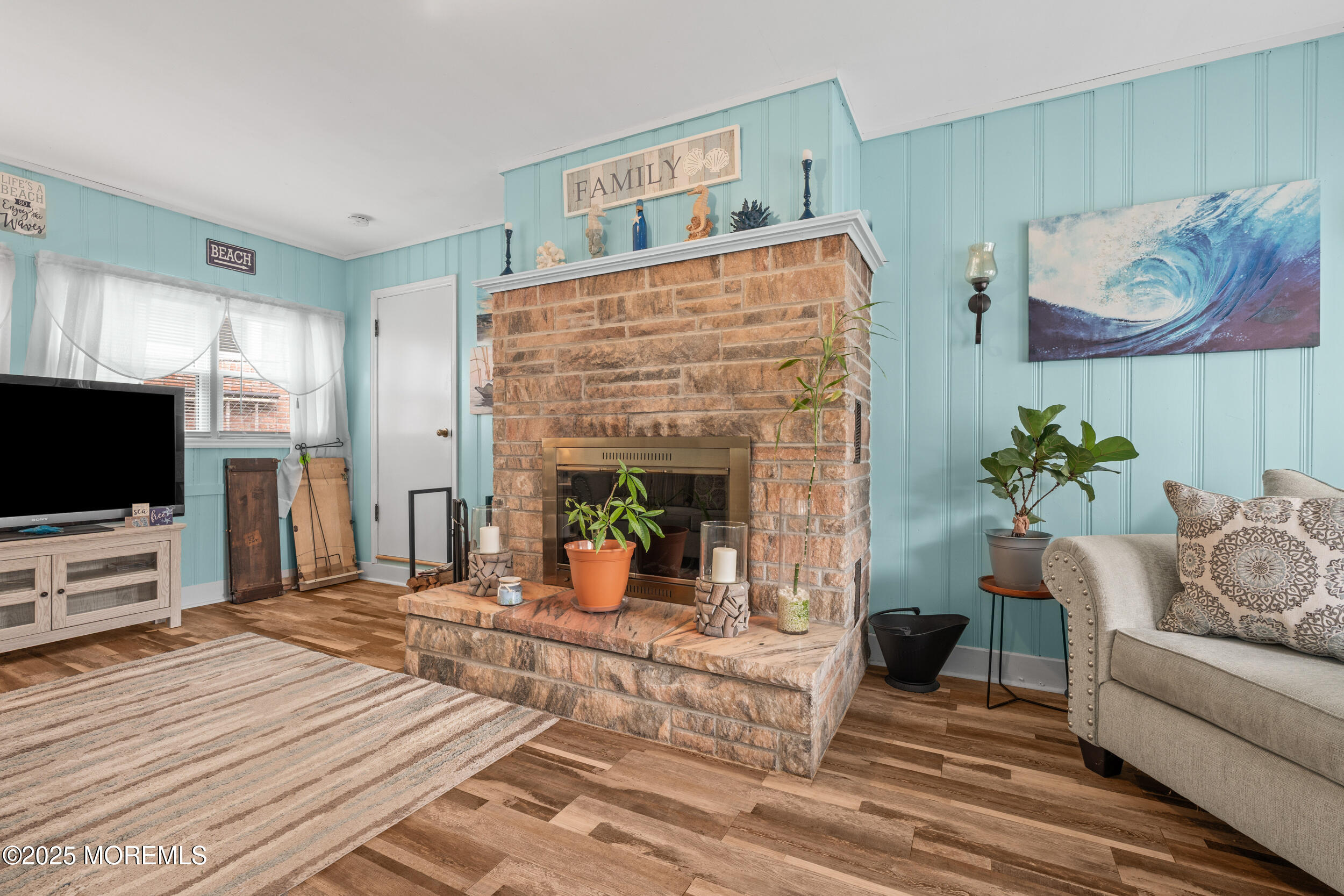 175 Shore Avenue Bogota, NJ 07603 - Photo 8 of 37 a living room with furniture and a flat screen tv