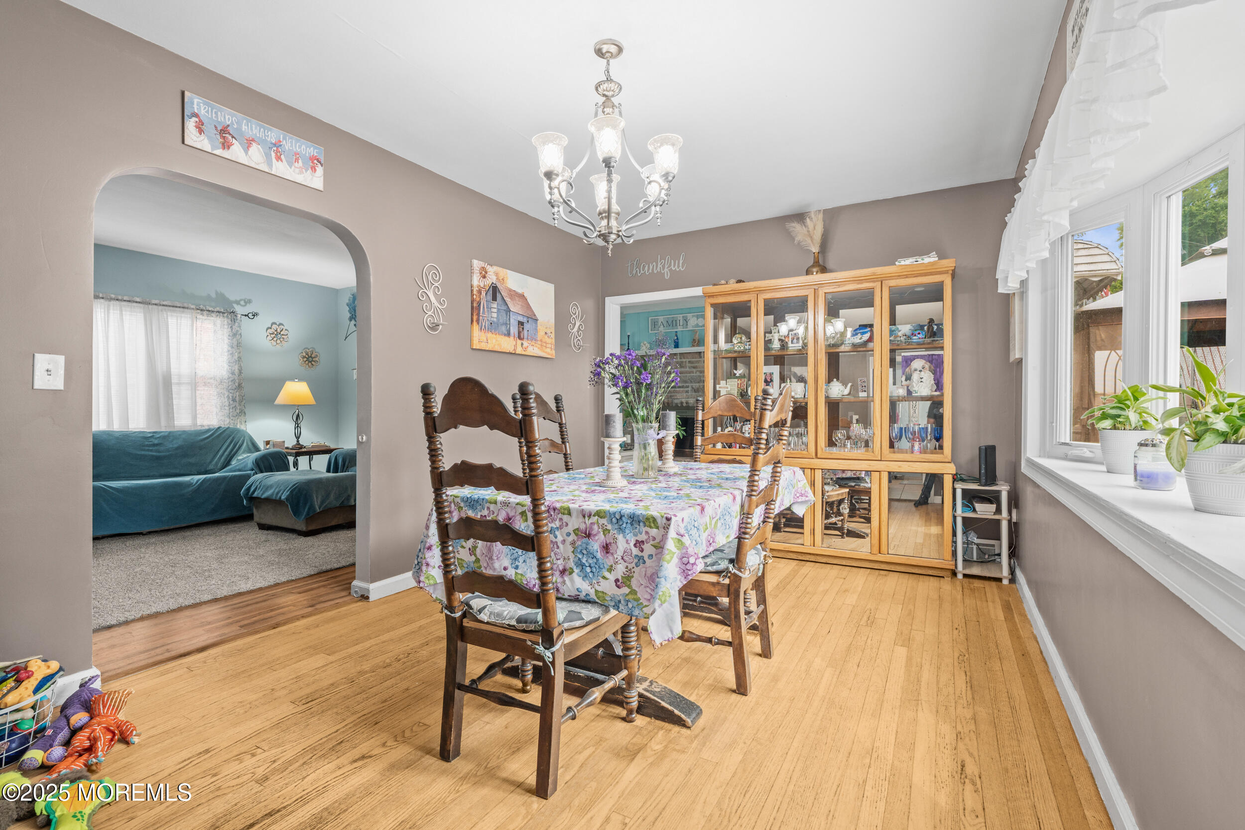 175 Shore Avenue Bogota, NJ 07603 - Photo 9 of 37 a view of a dining room with furniture and chandelier