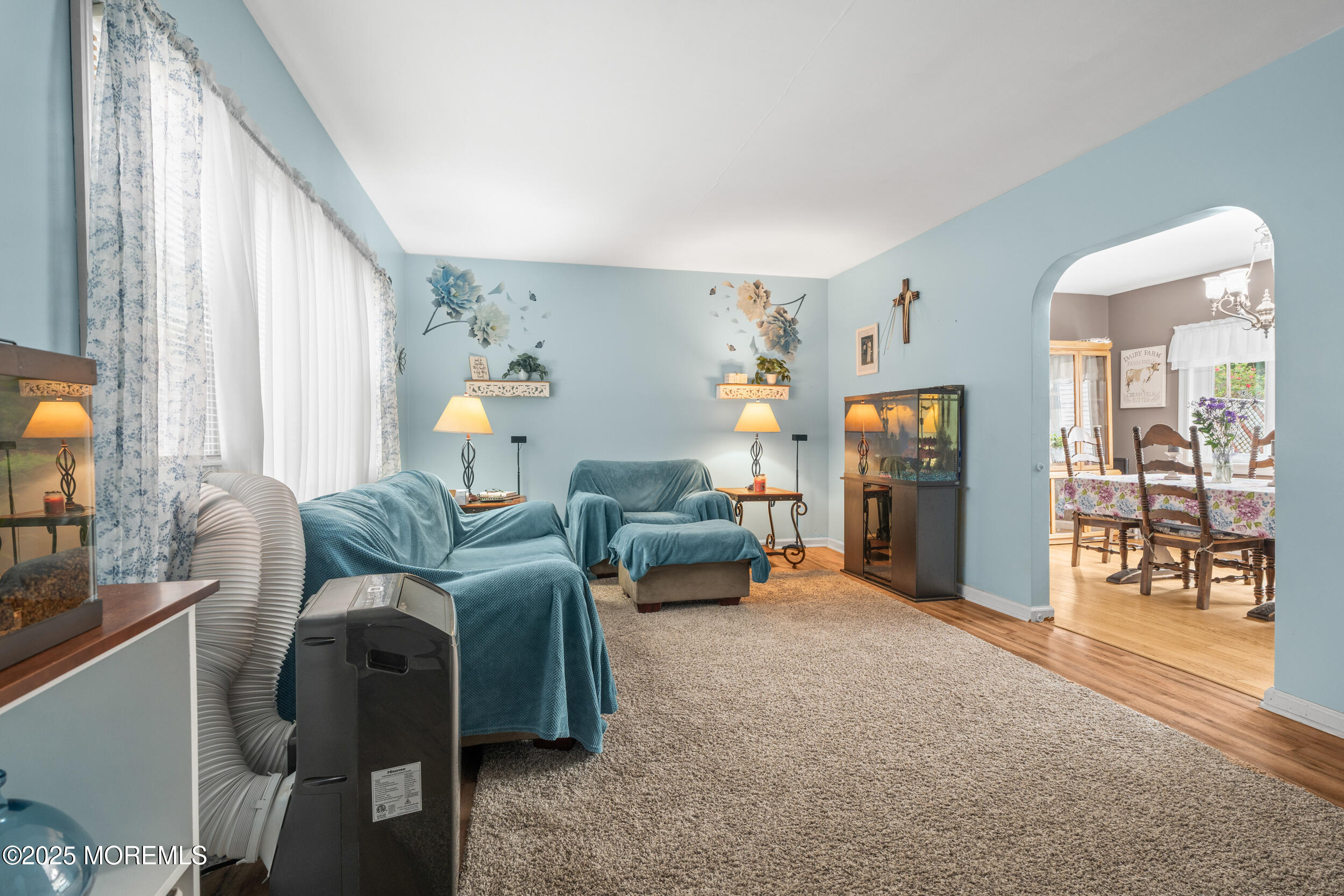 175 Shore Avenue Bogota, NJ 07603 - Photo 10 of 37 a living room with furniture and a fireplace