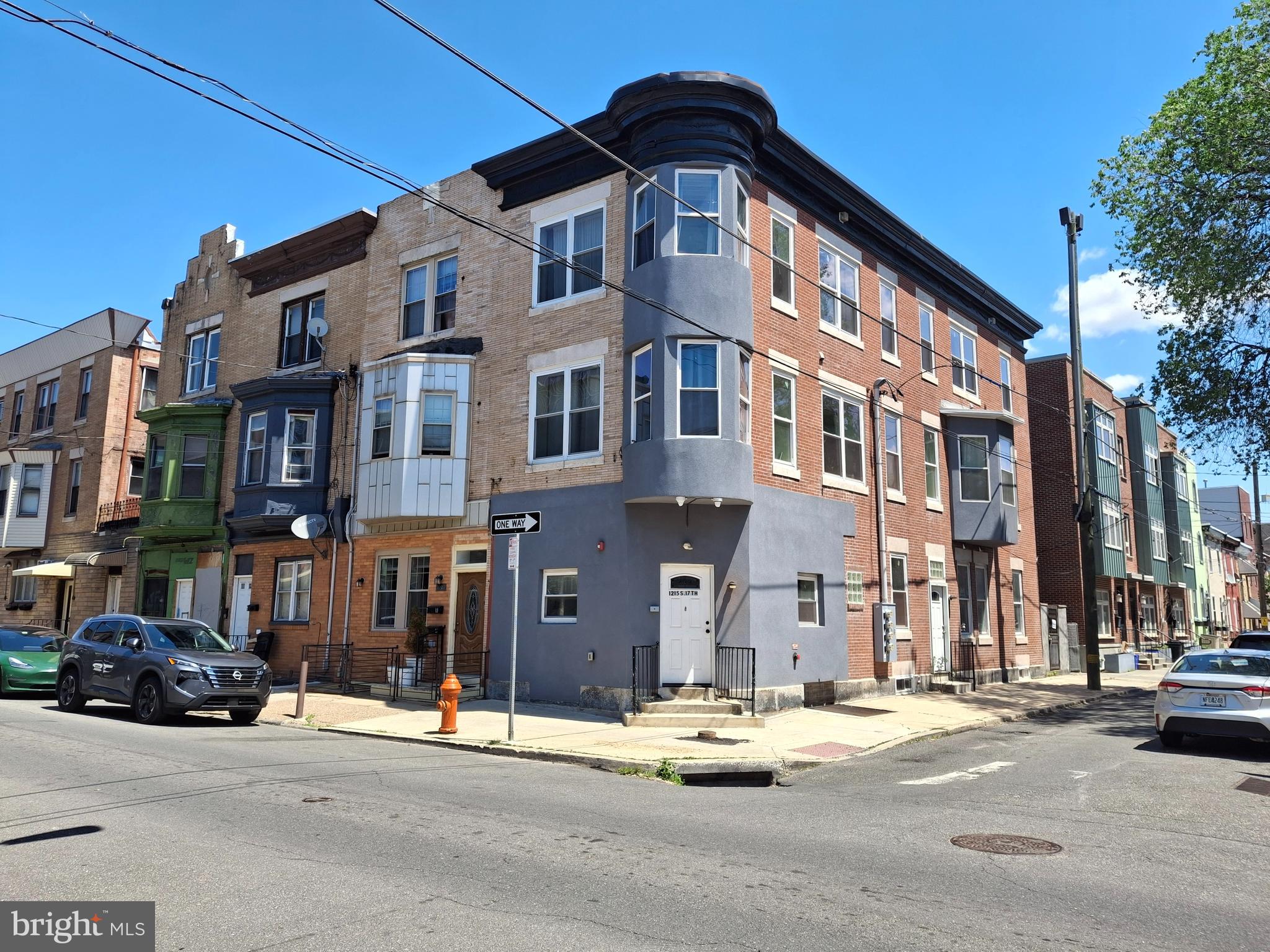 1215 South 17th Street, Unit 1 Philadelphia, PA 19146 - Photo 1 of 1 a front view of a building with street