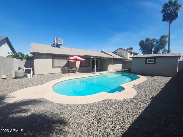 a view of a house with a swimming pool