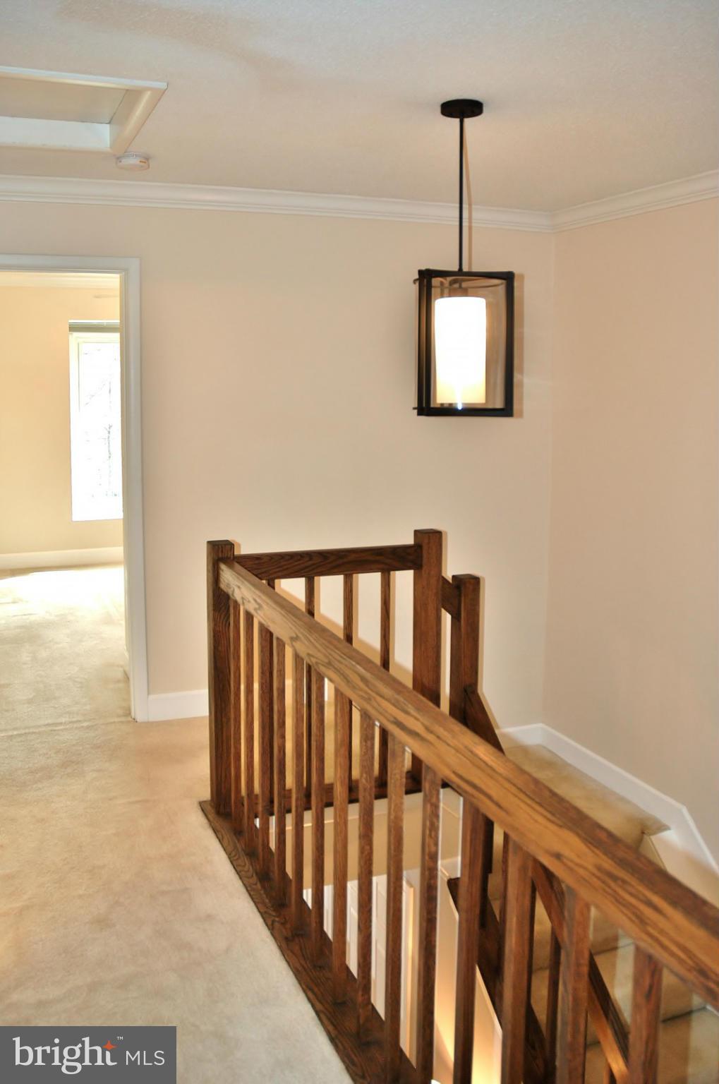 1432 Newport Spring Court Reston, VA 20194 - Photo 9 of 29 Upper Level Hallway. Hand Stained Handrails
