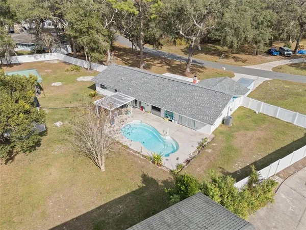 an aerial view of residential houses with outdoor space