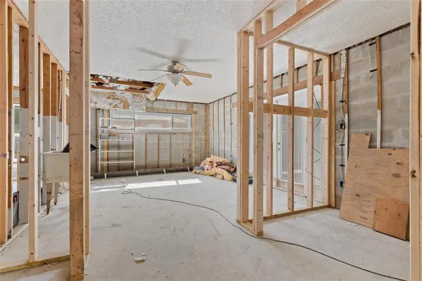 a view of a hallway with wooden cabinet and door