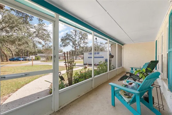 a room with furniture and a large window
