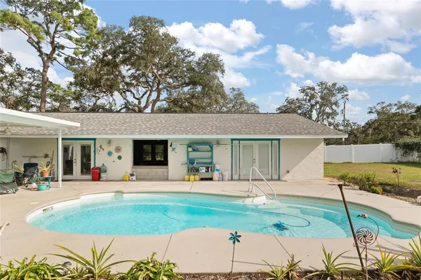 a house view with a sitting space and garden space