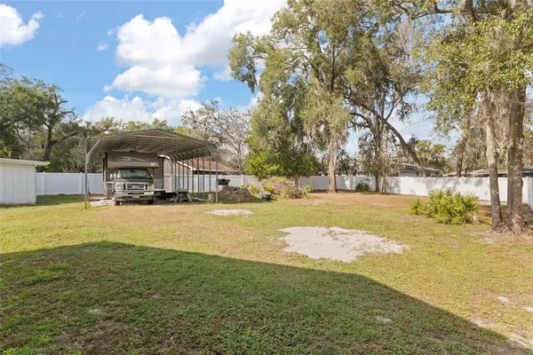 a swimming pool view with a outdoor seating