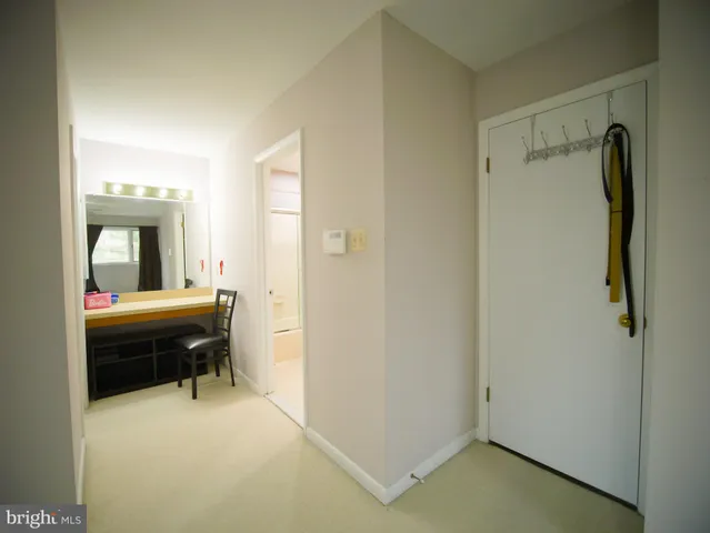 a bedroom with a bed and a mirror