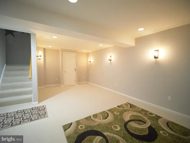 a view of kitchen and empty room