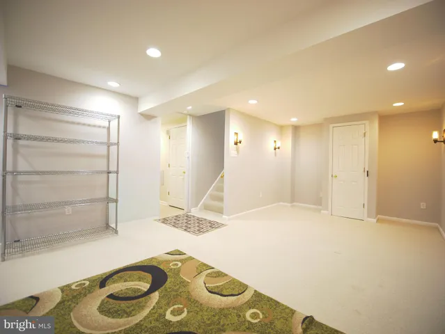 a view of a backyard with a small cabin and furniture