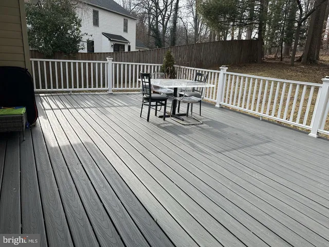 a view of a balcony with wooden floor