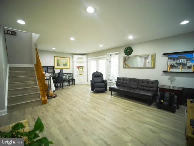 a view of a livingroom with furniture and a fireplace