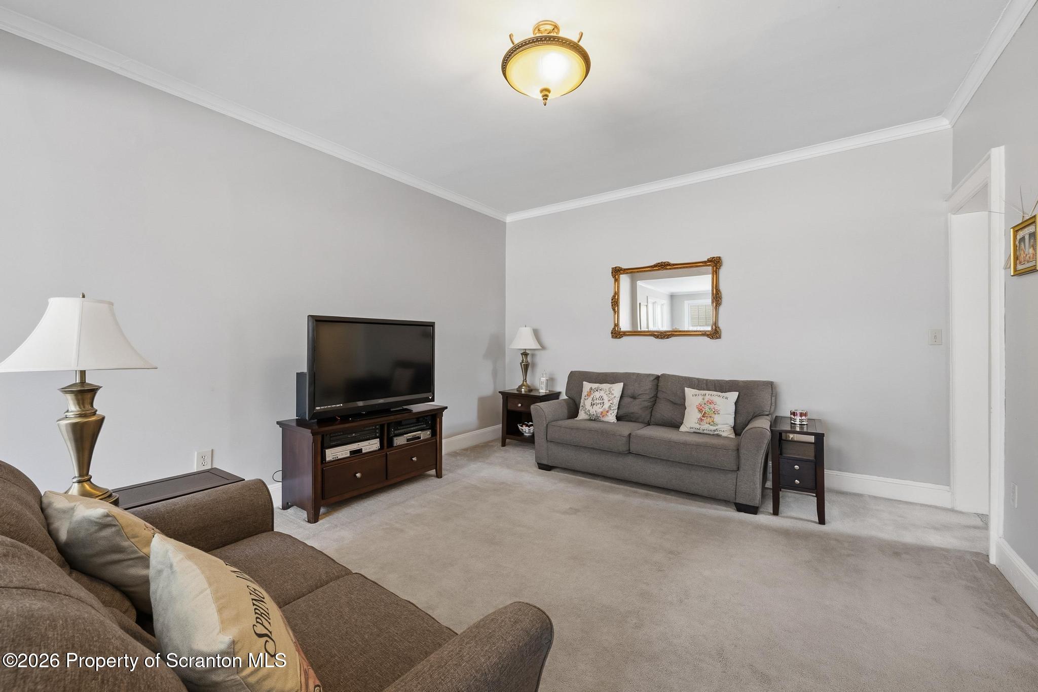 616 Myrtle Street Scranton, PA 18510 - Photo 7 of 65 a living room with furniture and a flat screen tv