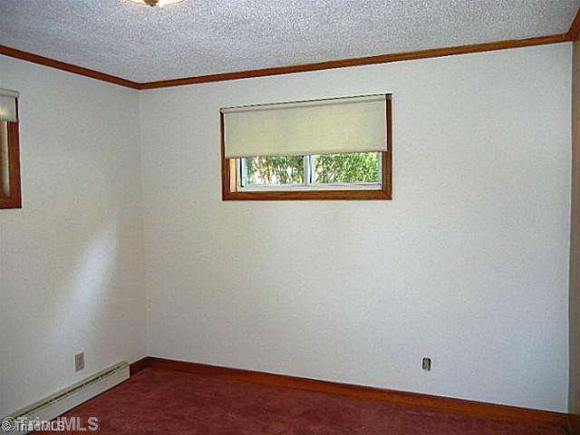 1094 Hickory Tree Road Winston-Salem, NC 27127 - Photo 11 of 16 3rd Bedroom. This bedroom is on the other side of the Great Room for privacy.