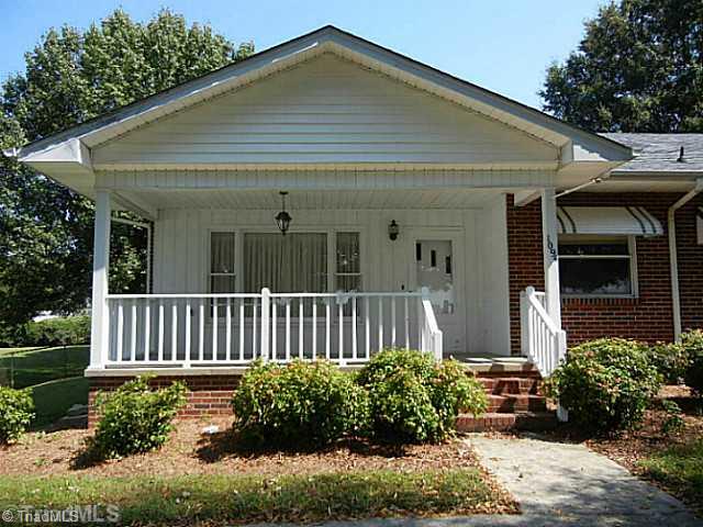 1094 Hickory Tree Road Winston-Salem, NC 27127 - Photo 13 of 16 Exterior Front. Large rocking chair front porch to enjoy.