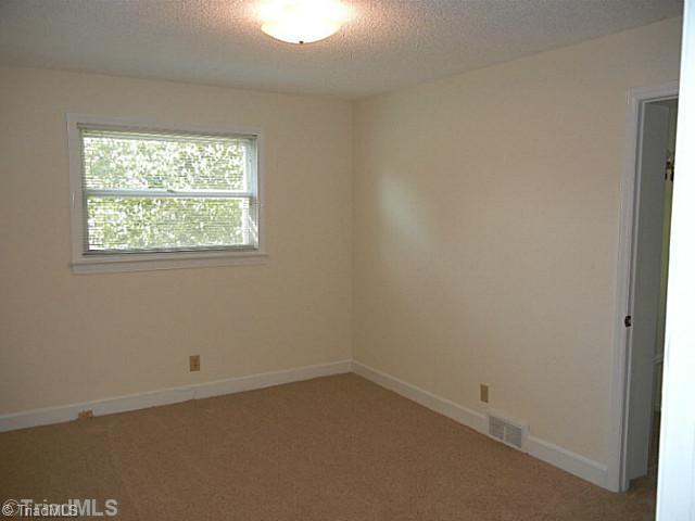 1094 Hickory Tree Road Winston-Salem, NC 27127 - Photo 6 of 16 Master Bedroom. Master bedroom has new carpeting, overhead light fixture and private bath.