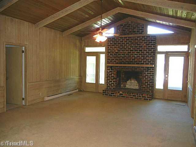 1094 Hickory Tree Road Winston-Salem, NC 27127 - Photo 8 of 16 Den/Family/Great Room. Large great room with cathedral ceilings, ceiling fan, FP and lots of natural light.