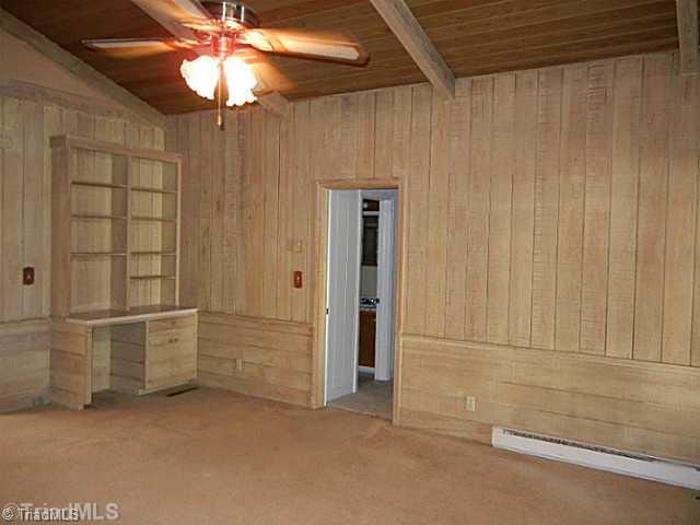 1094 Hickory Tree Road Winston-Salem, NC 27127 - Photo 9 of 16 Den/Family/Great Room. Another view of the great room shows built in desk and shelving.