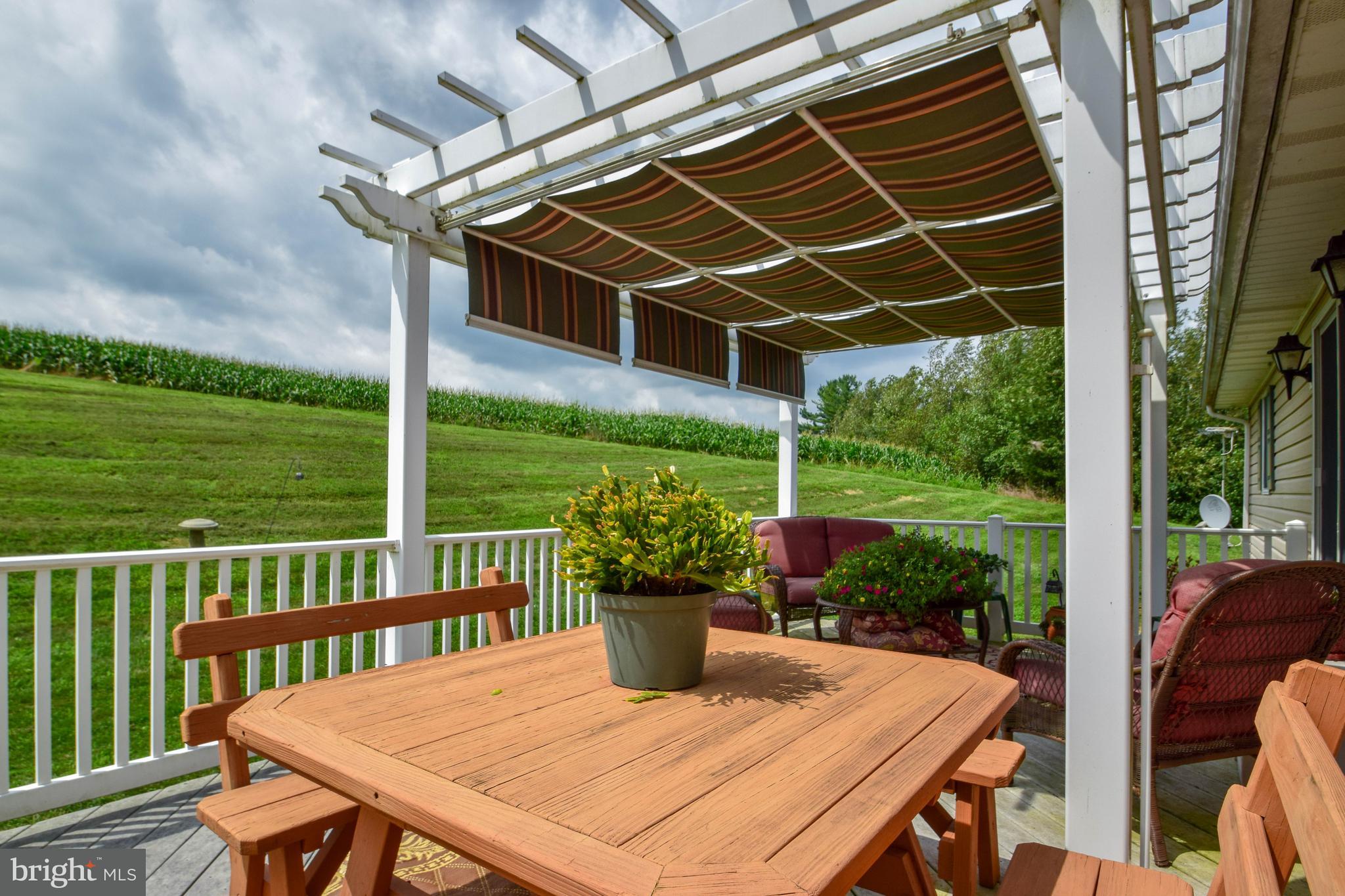 899 Impounding Dam Road Hanover, PA 17331 - Photo 22 of 51 a view of a patio with a table chairs and a table