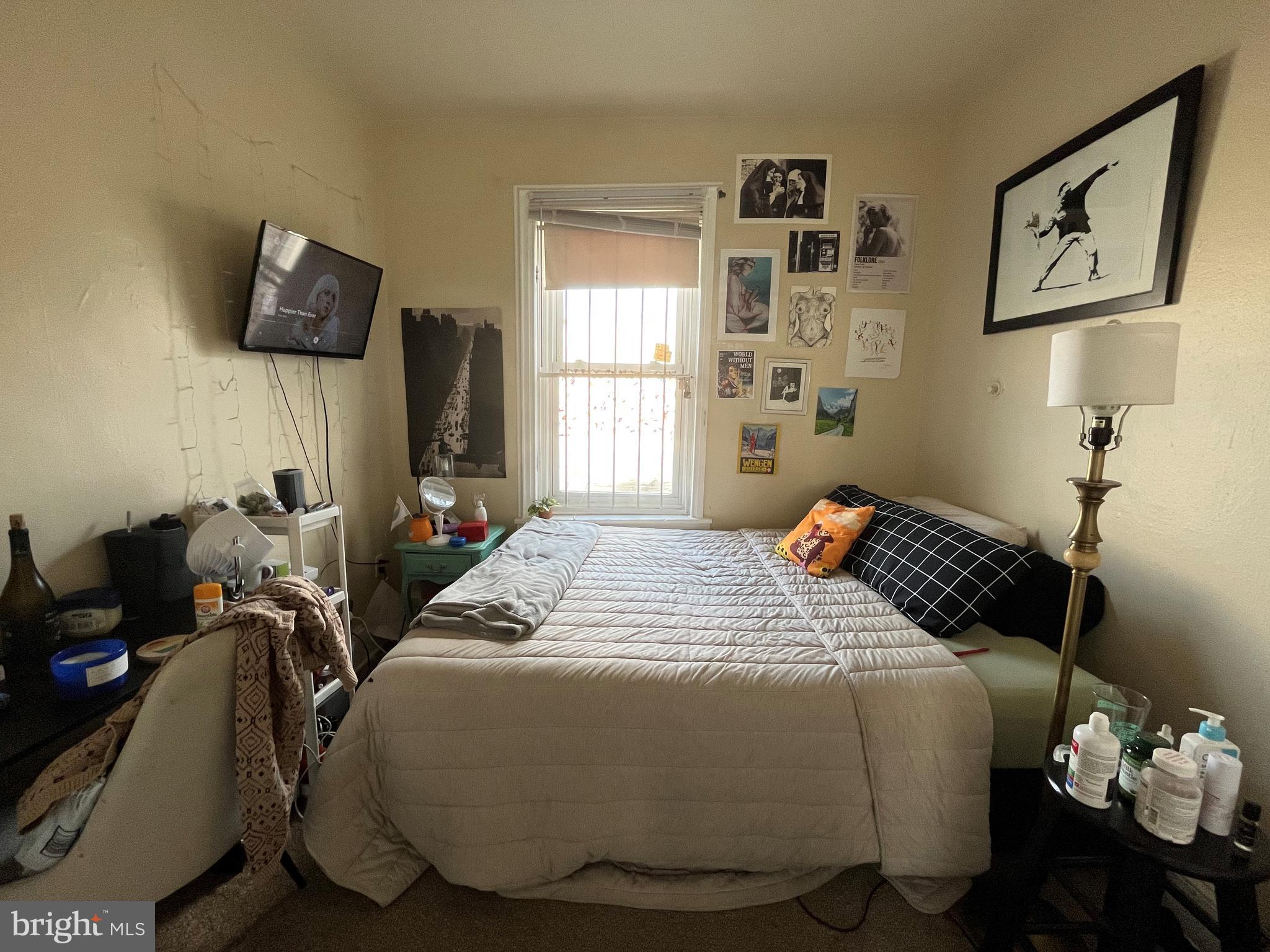 1429 West Norris Street, Unit 1 Philadelphia, PA 19121 - Photo 14 of 15 a bedroom with bed and window