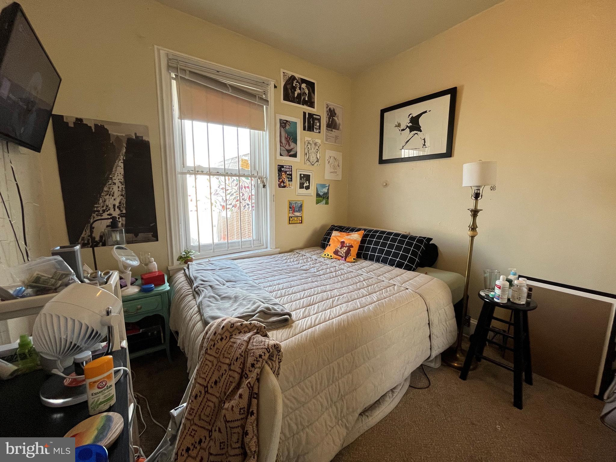 1429 West Norris Street, Unit 1 Philadelphia, PA 19121 - Photo 15 of 15 a bedroom with a bed and wooden floor