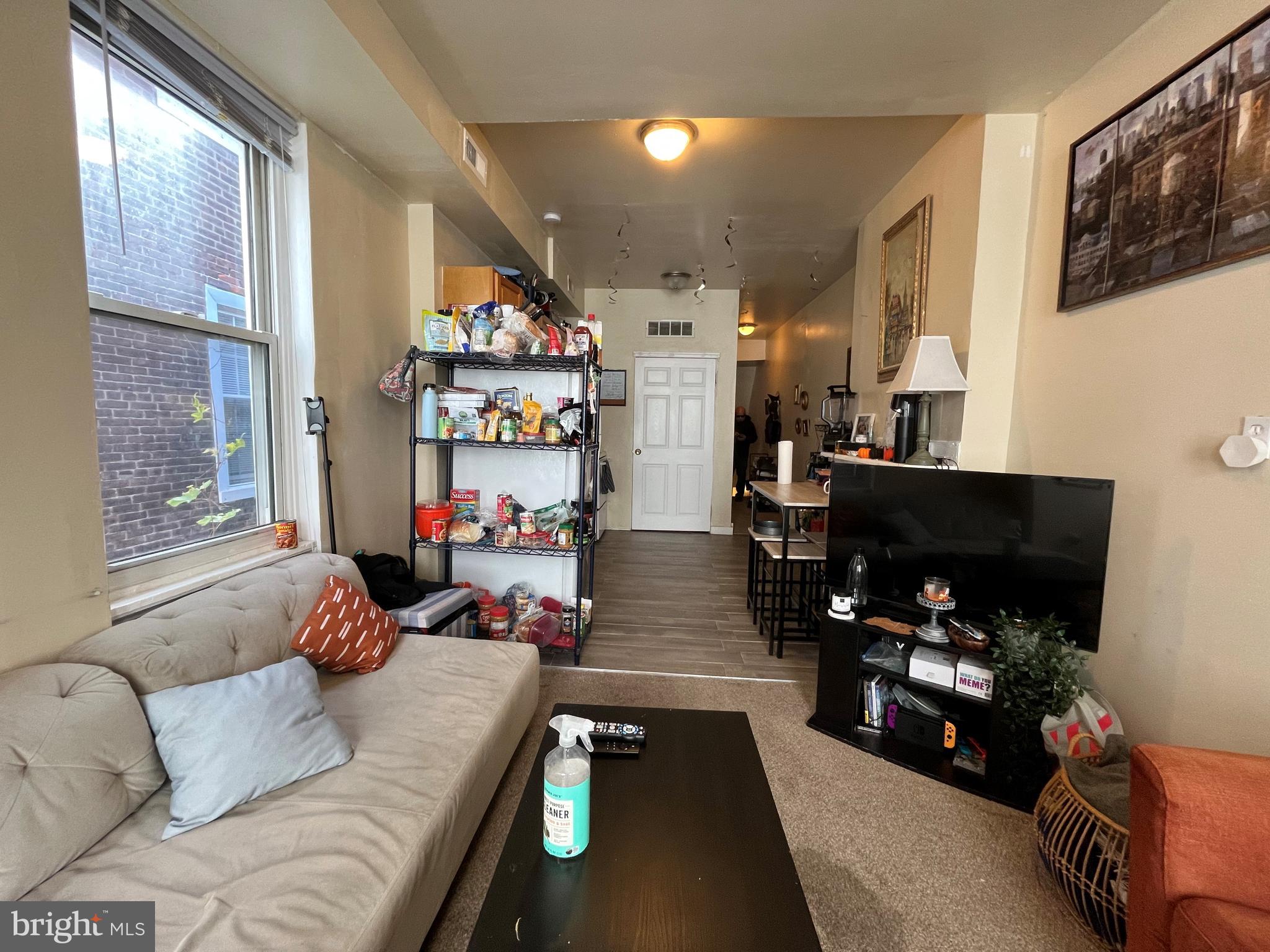 1429 West Norris Street, Unit 1 Philadelphia, PA 19121 - Photo 2 of 15 a living room with furniture and a flat screen tv