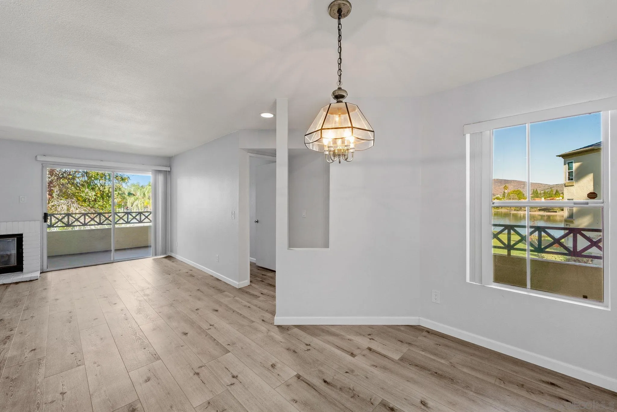 767 Brookstone Road, Unit 201 Chula Vista, CA 91913 - Photo 11 of 56 a view of empty room with wooden floor and windows