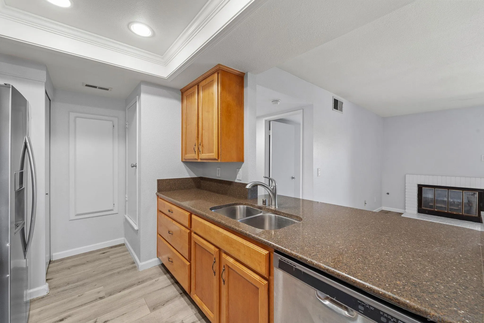 767 Brookstone Road, Unit 201 Chula Vista, CA 91913 - Photo 12 of 56 a kitchen with granite countertop a sink and a stove top oven