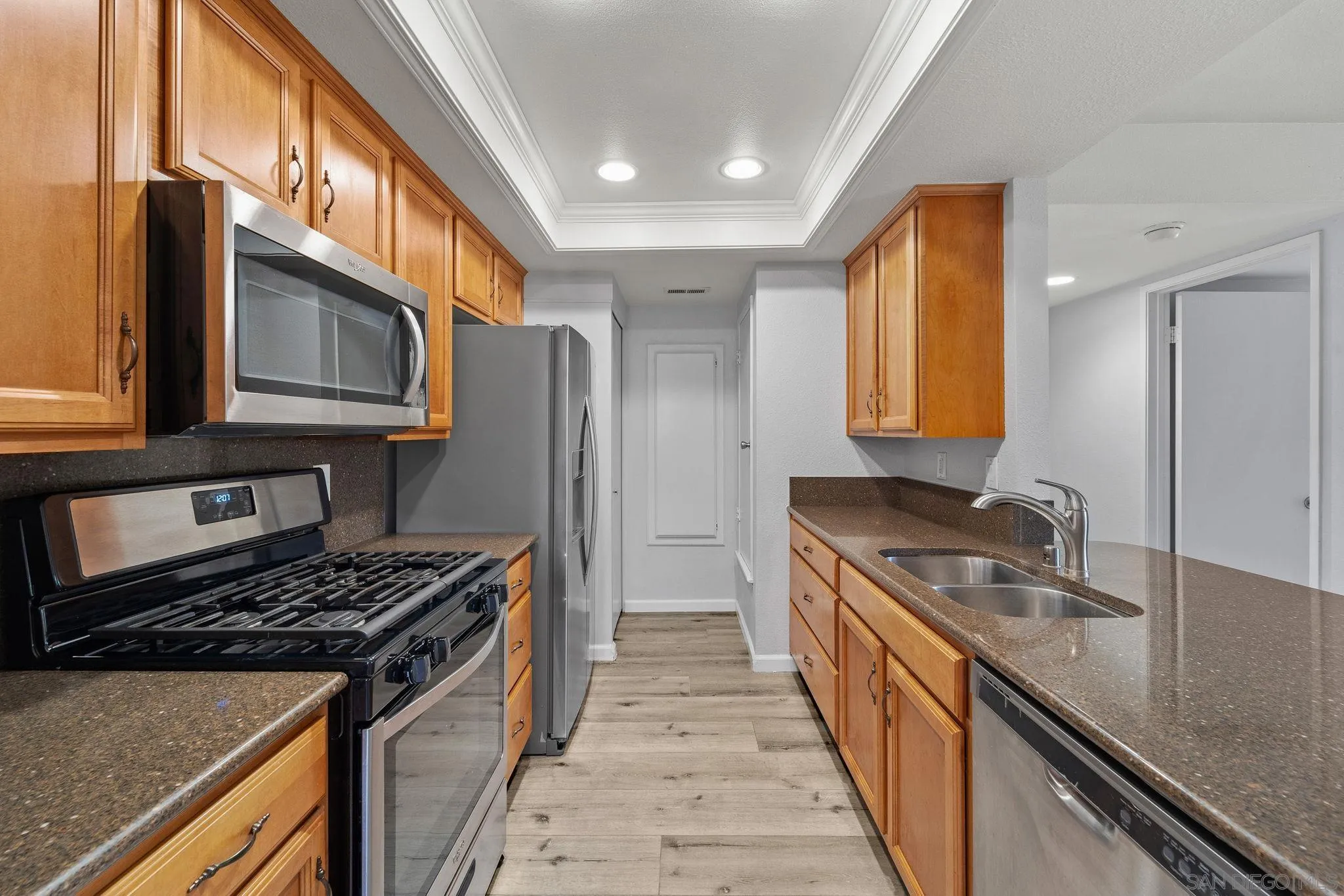 767 Brookstone Road, Unit 201 Chula Vista, CA 91913 - Photo 13 of 56 a kitchen with stainless steel appliances granite countertop a stove a sink and a refrigerator