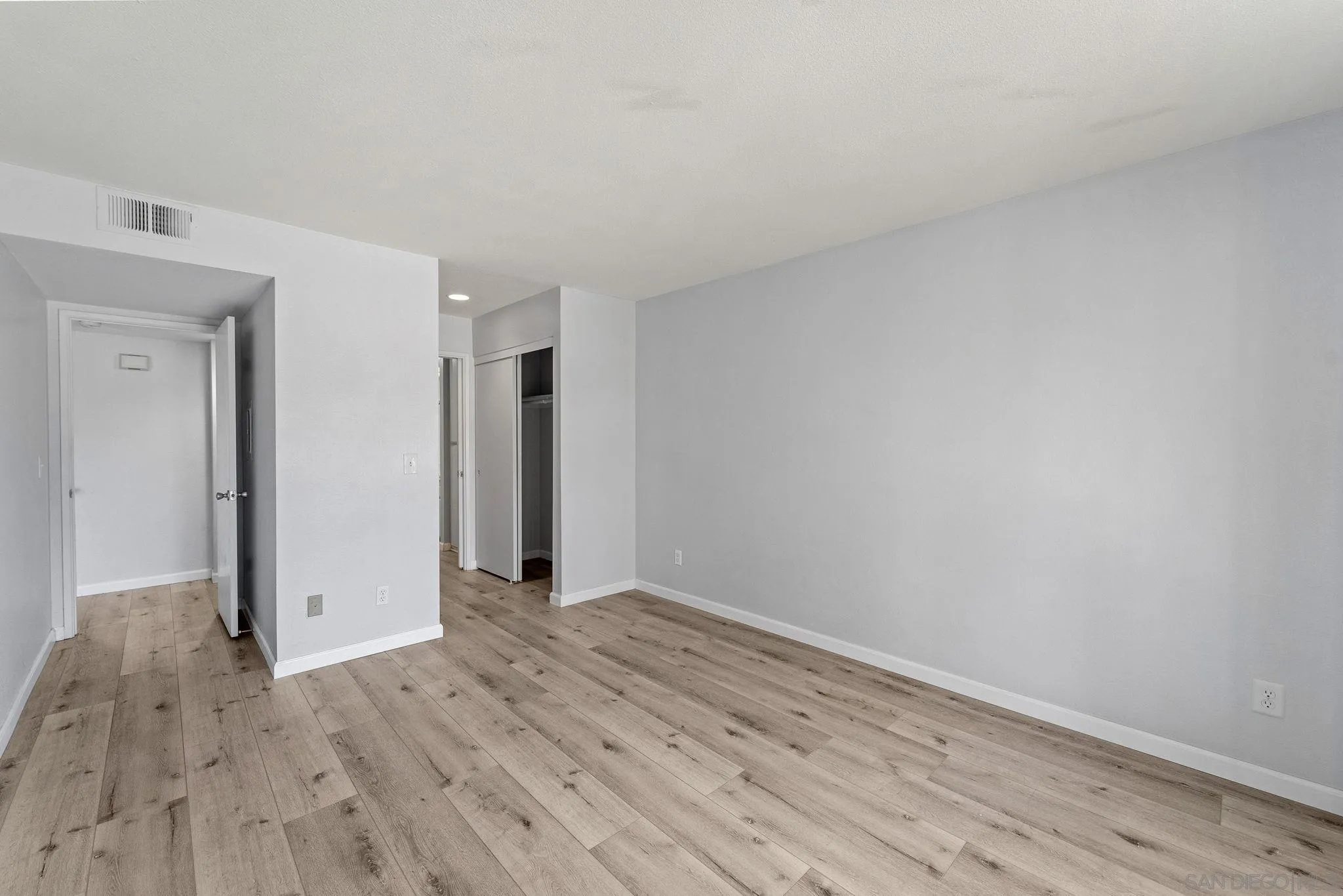 767 Brookstone Road, Unit 201 Chula Vista, CA 91913 - Photo 20 of 56 a view of an empty room with wooden floor and closet