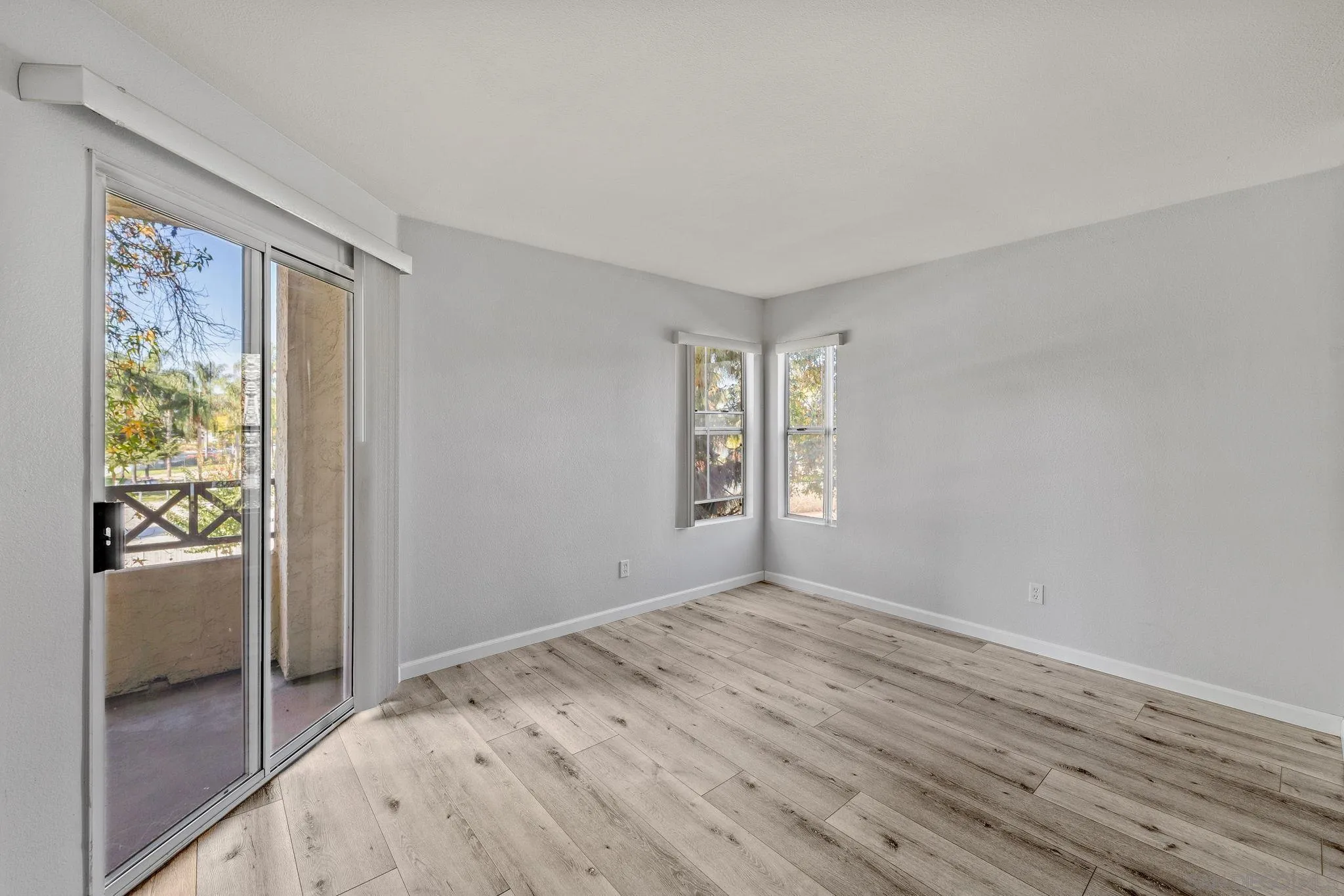 767 Brookstone Road, Unit 201 Chula Vista, CA 91913 - Photo 24 of 56 wooden floor in an empty room with a window