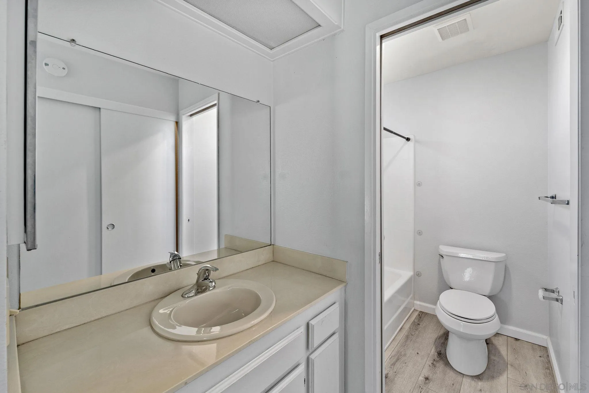 767 Brookstone Road, Unit 201 Chula Vista, CA 91913 - Photo 27 of 56 a bathroom with a granite countertop sink toilet and shower